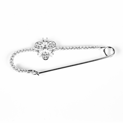 Silver brooch with zircons